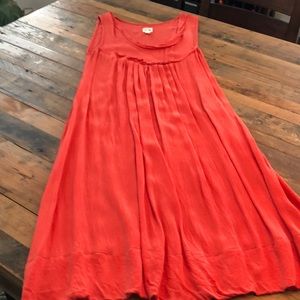Salmon color slip dress.
